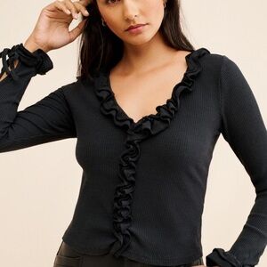 VTG Un Deux Trois black 3/4 sleeve v neck top with ruffle accents